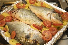 Fish and potatoes,baked fish with tomatoes